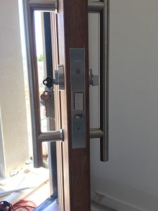 a locksmith that can supply and fit a new security lock for a townhouse into a timber door with a key