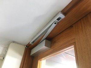 locksmith that can supply and install a door closer for low profile ceiling